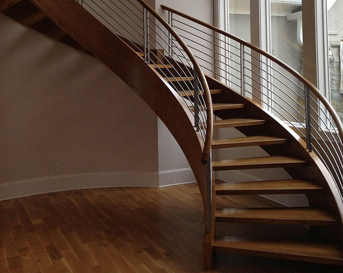 Chi phí lan can cầu thang inox tay vịn gỗ